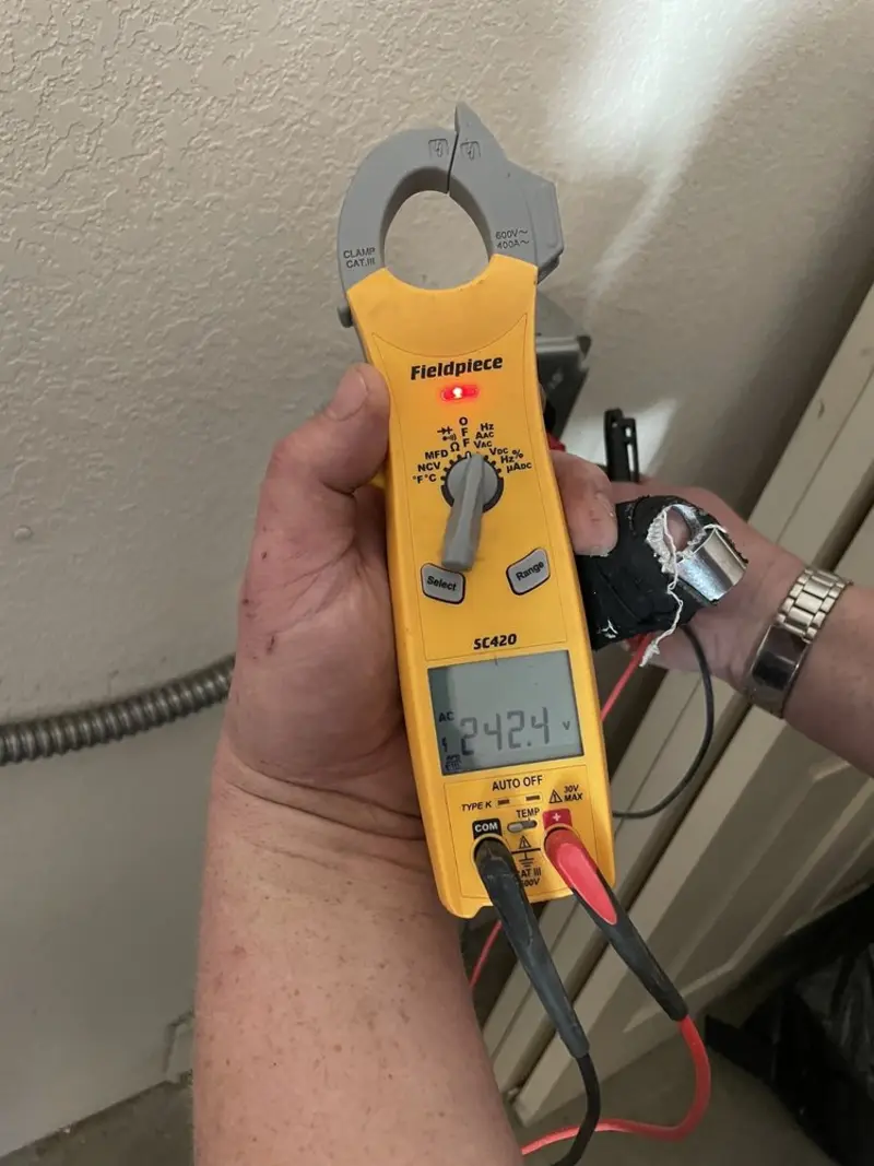 Voltage testing with clamp meter during Whole House Surge Protector in Carver